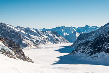 Panorama view of Jungfrau Mountain Range in Switzerland with Great Aletsch Glacier.