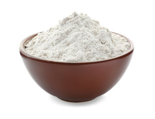 Bowl with wheat flour on white background