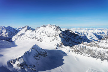 Fototapeta na wymiar Mountain peaks Aletsch glacier winter Swiss Alps Switzerland
