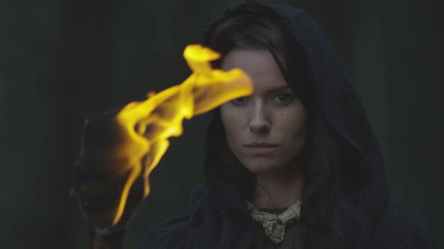 Close up of a woman with a fire torch