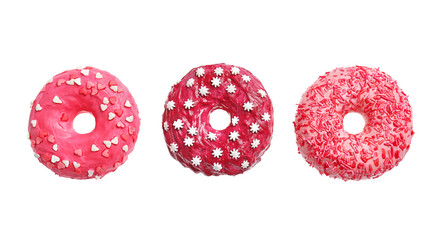 Delicious pink donuts on white background