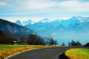Road at Sigrilwil village Swiss Alps mountains Thun lake