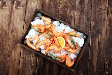 Raw fresh Prawns Langostino Austral. shrimp seafood with lemon and spices.