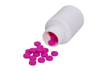 Pills fall out of bottles, on white background