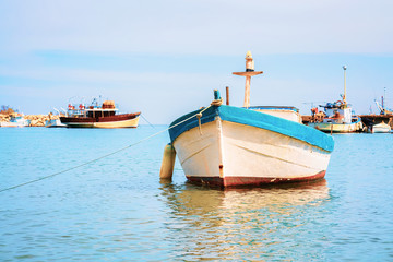 Obraz premium Boat at Cefalu port in Mediterranean sea Sicily