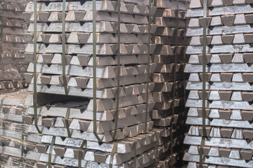 Close up of Aluminum on pallet Ingot storage in indoor warehouse for export as industrial...