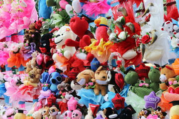 Fototapeta na wymiar many colorful toy dolls background,children dolls, toys for kid
