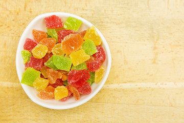 Colorful cubes of candy pineapple. View from above.