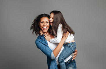 Overjoyed mother holding her daughter