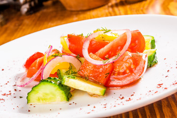 Vegetable salad on white plate. Close-up