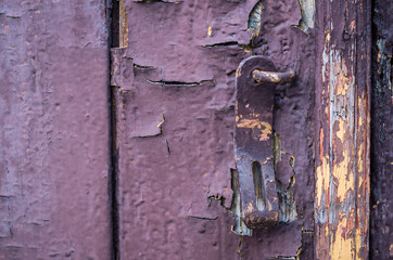 Old wooden red painted door with lock
