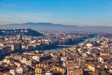 Fototapeta premium Arno river top view over the rooftops of Florence, Toscana, Italy