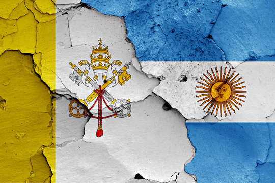 flag of Vatican and Argentina painted on cracked wall