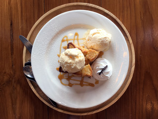 honey toast with ice-cream on a wooden table.