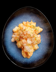 Shrimps cooked in Asian style with bonito tuna, isolated