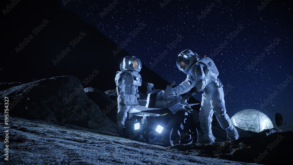 Canvas Prints two astronauts in space suits on an alien planet prepare space rover for surface exploration mission