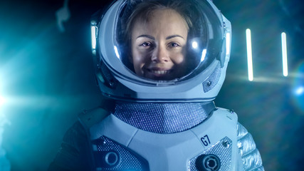 Portrait of the Beautiful Female Astronaut on the Alien Planet Looking around in Wonder, Smiles. In...