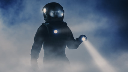 Courageous Astronaut in the Space Suit Holds Flashlight and Explores Mysterious Alien Planet...
