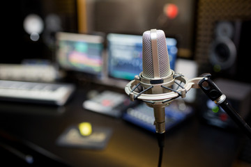 Professional microphone in the recording studio.