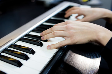 Obraz premium Close up woman playing piano.