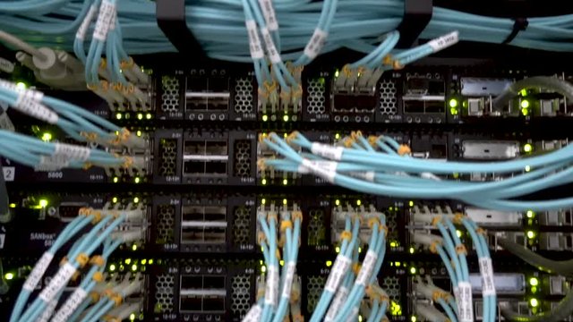 MOSCOW, RUSSIA - March 10: Optical fiber. Severs computer in a rack at the large data center. Optical server. Commutator. flashing lights.  on March 10, 2018 in Moscow, Russia. Editorial 