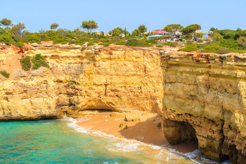 View of beautiful cliffs on sea coast near Carvoeiro town, Algarve, Portugal