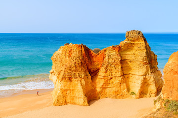 Rocks on beautiful sandy Praia da Rocha beach in Portimao town, Algarve, Portugal