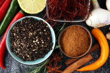 Spices and herbs on grey background. Food and cuisine ingredients.