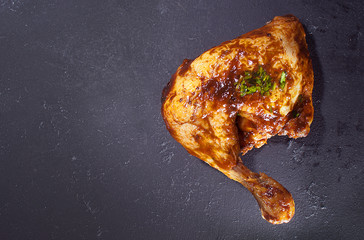 Fried chicken leg on a black chalk Board