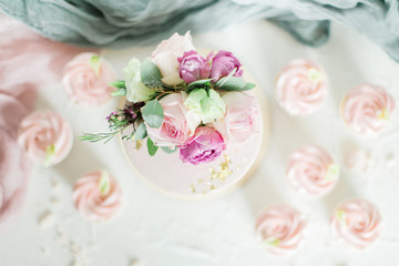 Wedding cake decorated with roses and flowers. Top view, flat way
