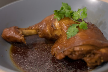 Chicken wings cooking by boiled with fish sauce and herb very delicious on top by coriander. Make for special meal 