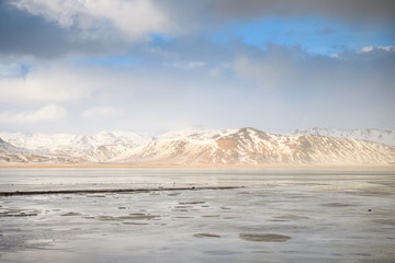 snowed mountain range view in winter, iceland