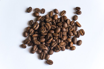 Coffee beans on white background, close up