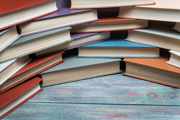 Fototapeta premium Book stacking open book hardback books on wooden table. copy space