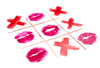 view of tic-tac-toe with black crosses and lips prints