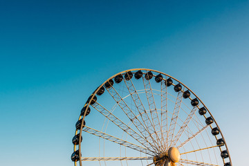Ferris wheel against the blue sky