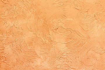 Beautiful textured wall of yellow color. Rough and rubbed