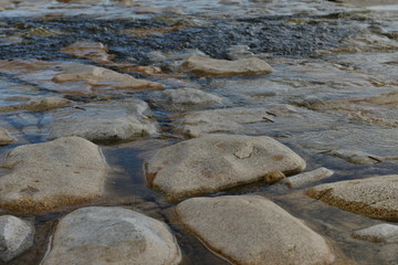 Stream over granite, U.K.
Water run off running to the coast.