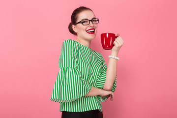 Businesswoman with hair bun and cup