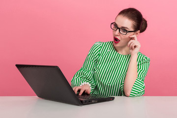Businesswoman with hair bun and laptop