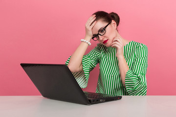 Businesswoman with hair bun and laptop