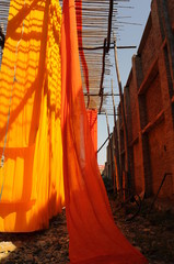 orange fabric, textile Industry , rural Rajasthan, India