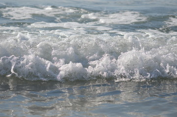 Zoom on the beach from the mediterranean sea (italy)