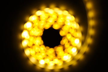 Shining diode strip. LED lights tape. Blur bokeh abstract background