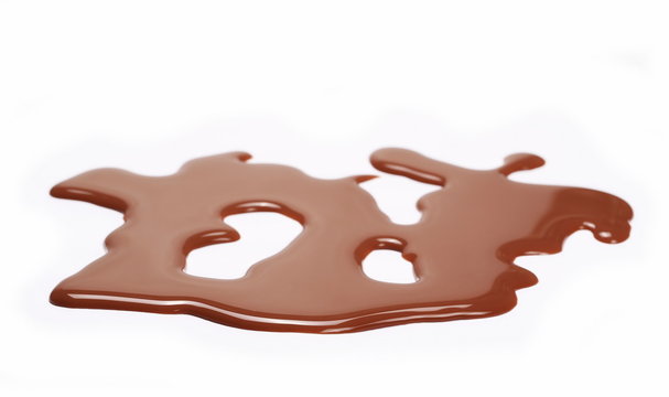 Spilled chocolate milk puddle isolated on white background
