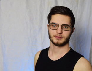 Fototapeta premium guy with a beard wearing glasses