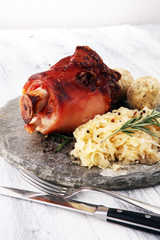 Roasted pork knuckle. Ham and bacon are popular foods in the west. German Schweinshaxe or Haxe
