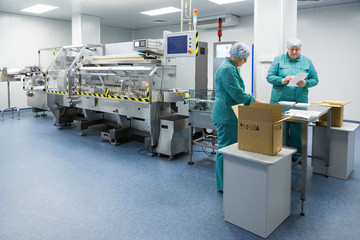 Pharmaceutical factory workers in sterile environment