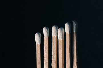 Grouped grey matchsticks in a row