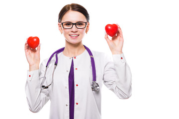 Young beautiful female doctor holding hearts in her hands on white background